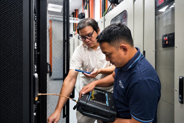 SGS engineers working at the equipment racks